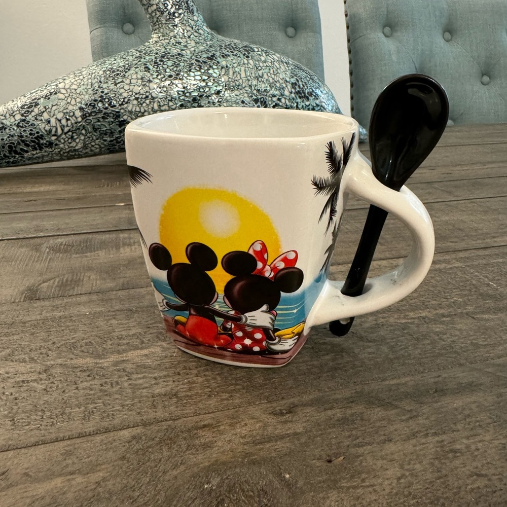 Disney tea mug with spoon.